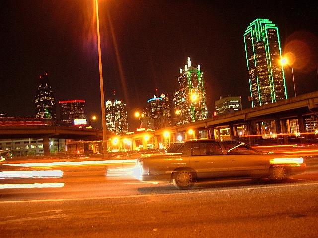 05044 Downtown Dallas at night As featured on the cover of the book His Strange Ways by Robin Hardy.